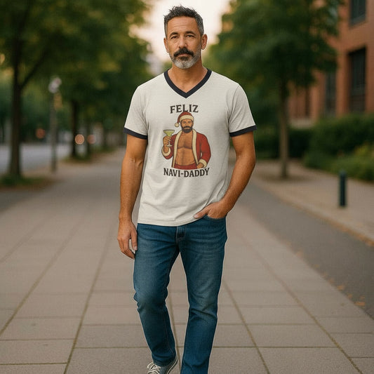 Man wearing a t-shirt with a graphic design and text, standing on a sidewalk.