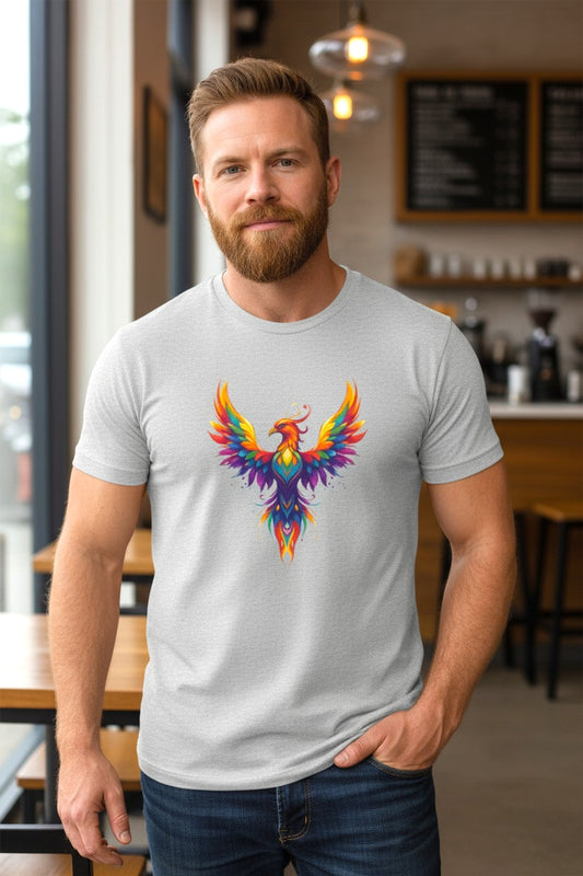 Man wearing a gray t-shirt with a colorful phoenix design in a casual setting.